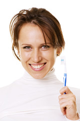 happy woman with toothbrush over white background