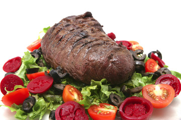 meat and vegetables on transparent dish