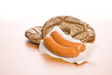 fresh round bread with sausage .