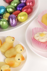 dishes filled with various delicious candy and easter chocolates