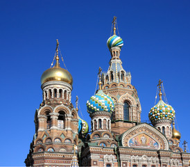 Fototapeta na wymiar Domes of orthodox church on a blue sky background.