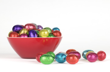 a dish filled with colorful easter chocolates