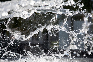 Splashes of water in city fountain