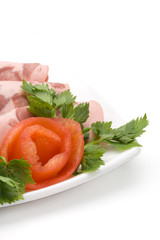 The sausage cut by slices on a dish