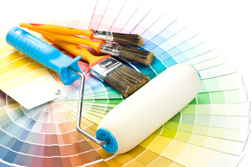 Brushes and paint-roller on a colour guide