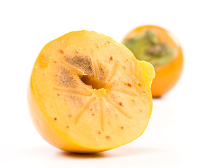 Fresh appetizing persimmon on a white background