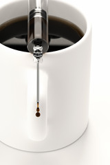 Coffee mug and syringe isolated over a white background.