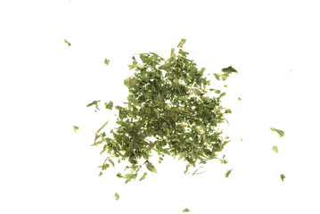Dried chopped Parsley leaves spread out on white
