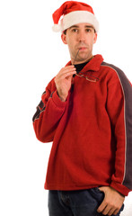 A young man wearing red and a santa hat,