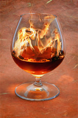 glass of burning  brandy.