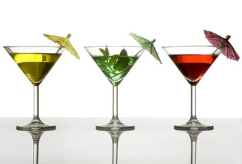 three cocktails with umbrella