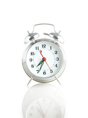alarmclock with reflection on a white background