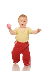 little girl with toys on a white background