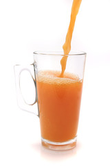 big glass filled orange juice