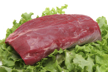 raw beef meat on salad