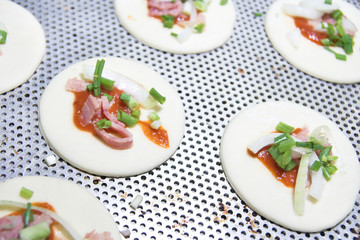 Making mini pizza cake at pastry