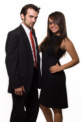 brunette woman wearing black formal dress and man in suit