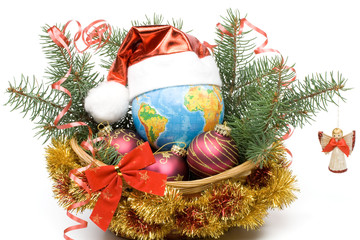 Decoration with an  firtree branch, globe and toys