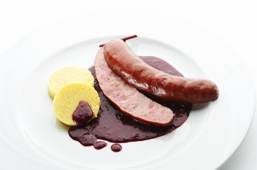 Pork sausage with red wine Goulash and Polenta