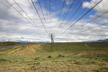 Line of Old telephone posts in Kazakh steppe.