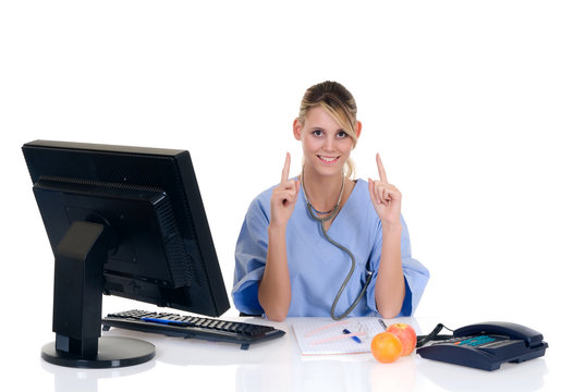 Attractive female doctor pointing to apple and orange, fruit,