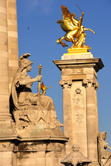 statues of the Alexandre's III bridge in France in Paris