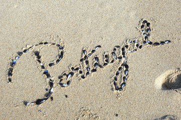 Portugal in words on the white sand in the north of the country