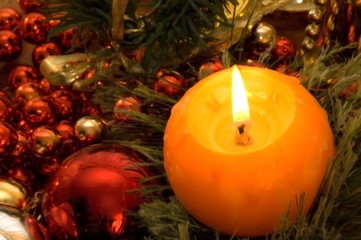 christmas decoration a candle and a fur tree sphere