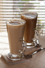coffee latte macchiato or hot chocolate in tall glasses