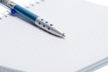 Pen and paper on a white background