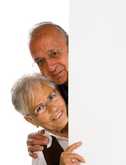 man & woman holding a blank over white background