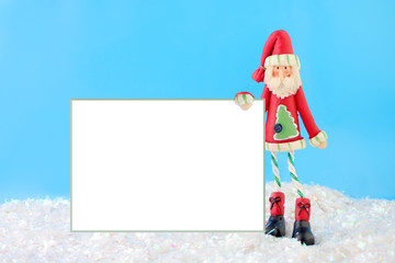 slim santa claus christmas decoration holding a blank sign