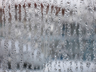 The misted over glass of a window