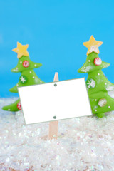 ceramic decorative christmas ornaments in a field of snow