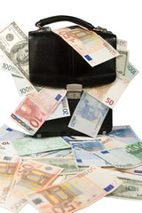 Black case full of euro and dollar bills (isolated on white)