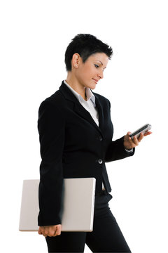 Happy businesswoman with mobile phone and laptop