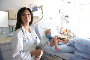 female doctor with a child in a hospital room