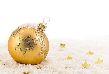 Golden Christmas ball on snow