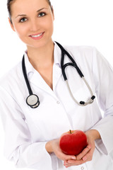 Female doctor holding apple