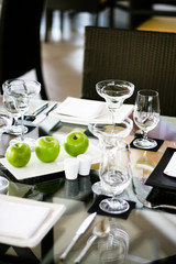 Elegant table setting with apples.