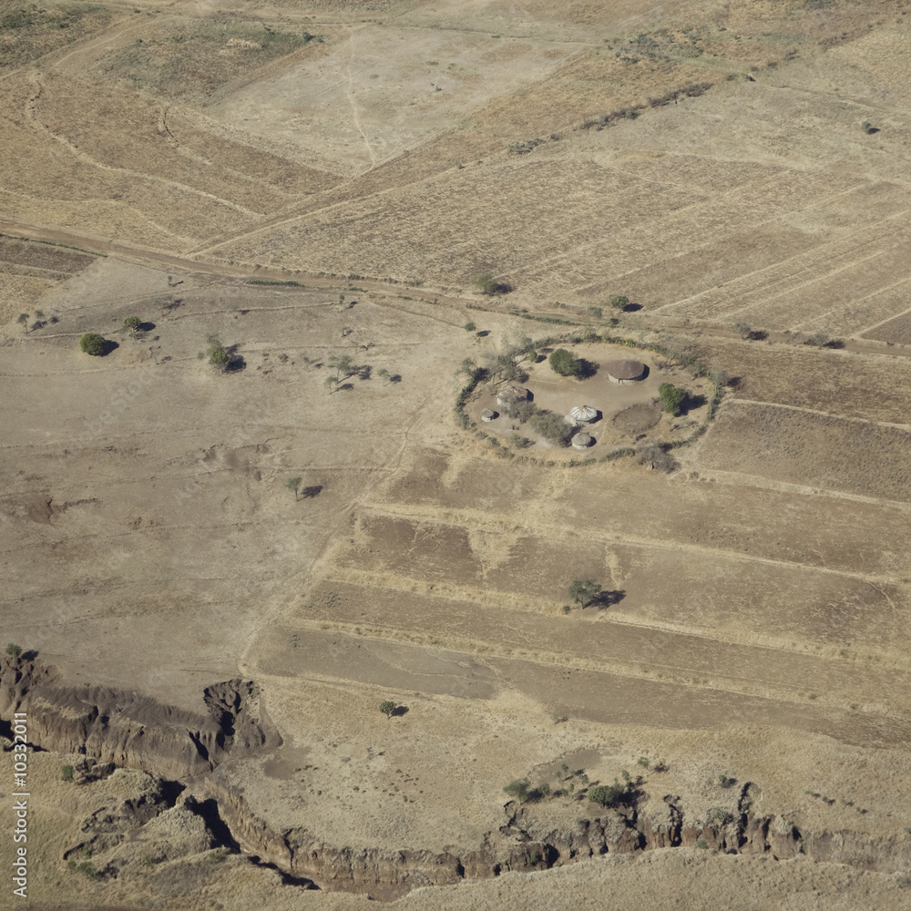 Wall mural aerial view  masai village in the dry plain around serengeti