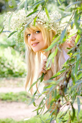 girl the blonde looks out because of foliage