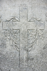 Granite stone made cross with flowers