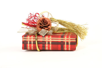 Christmas present in red paper with unusual decorations