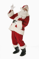 Santa Claus isolated on white background pointing upward
