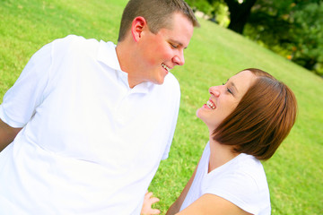 Fototapeta premium happy couple embracing in the park. young family