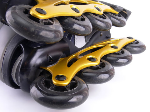 Two roller skate blades on white background closeup