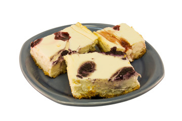 pieces of blueberry and strawberry swirl cheesecake
