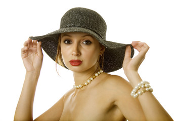 Sexy woman in hat and jewelry