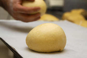 baker who works the paste in a french bakery
